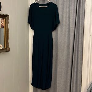 Deep green jumpsuit with open back
